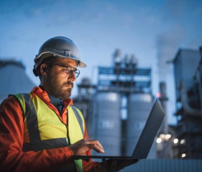 Engineer working with technology on the power station in the oil and gas industry.
